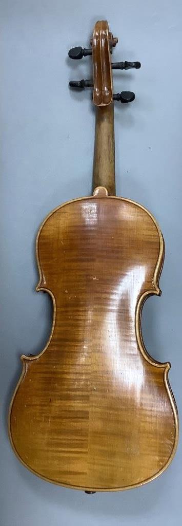 An early 20th century violin, unlabelled case, with bow, length 60cm